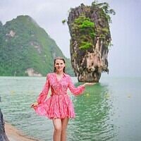 Husband Tourists in Krabi, Thailand, with Limestone Cliffs and Emerald Waters.